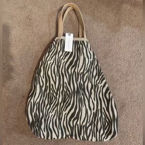 ⭐️ Anthropologie *NWT* Alena bag in sand color print